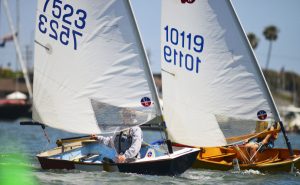 sabot skippers concentrating while sailing upwind