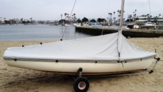 Lido 14 mast up cover. Comes with straps and elastic cord around the bottom to hold it against the hull. Comes in either Sunbrella or Top Gun fabric