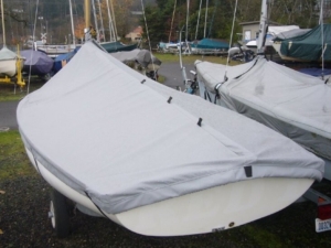Lido 14 mast up cover. Comes with straps and elastic cord around the bottom to hold it against the hull. Comes in either Sunbrella or Top Gun fabric