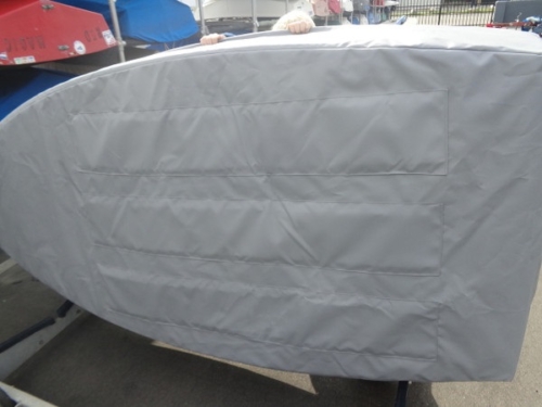 Opti / Optimist bottom cover. Protects your boat with extra padding on the bottom. Comes with straps, reflective tape, and elastic cord around the top to hold it against the hull. Choose either Sunbrella or Top Gun fabric in multiple colors.